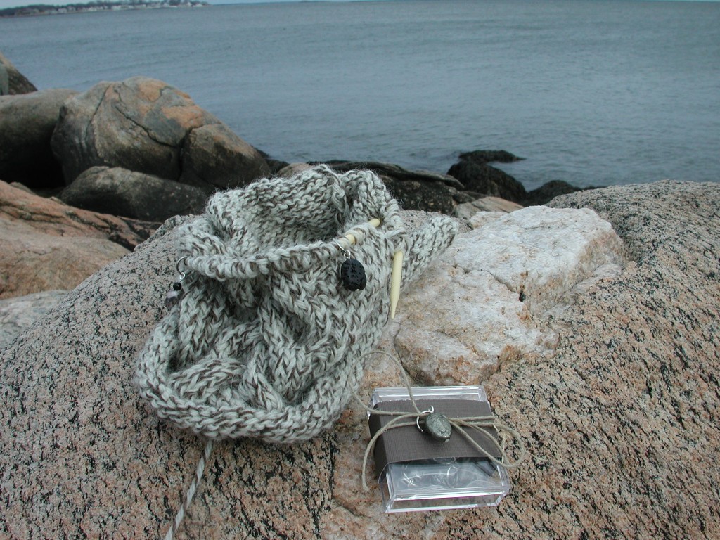 Intraclast stitch markers and a cabled WIP.
