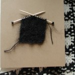 Knit notecards made by blind children in China as a fundraiser are available at Saybrook Yarn. That's a teeny-tiny WIP on tinier needles depicted here. Knit notecards made by blind children in China as a fundraiser are available at Saybrook Yarn. (That's an actual teeny tiny WIP and needles on the card depicted here.)