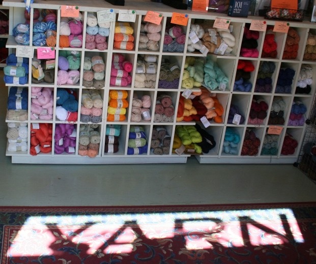 The word in the light says it all - a refuge from the busy busy world - Mystic River Yarns at Schooner Wharf on Holmes Street, Mystic, Connecticut.
