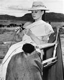 Audrey Hepburn knitting on set. Bettmann Corbis image.