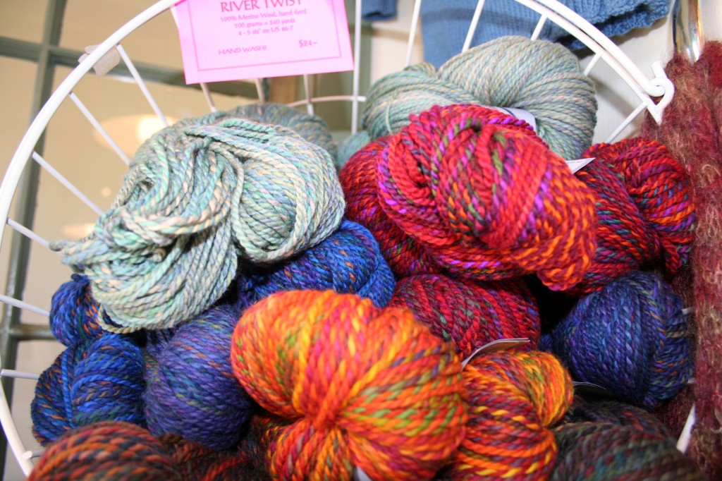 When visiting a yarn store, ask (or look) for yarns produced by area artisans. This lovely grouping is at Mystic River Yarns. When visiting a yarn store, ask (or look) for yarns produced by area artisans. This lovely grouping is at Mystic River Yarns.